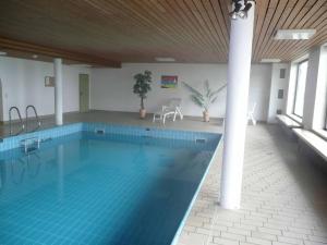 a large swimming pool in a large building at Fewo Herp in Oy-Mittelberg