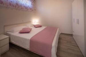 Posteľ alebo postele v izbe v ubytovaní Apartment Fragola