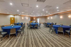 a conference room with blue tables and chairs at Comfort Inn Lancaster County North in Denver +25 photos