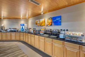 a restaurant with a counter with food on it at Comfort Inn Lancaster County North in Denver