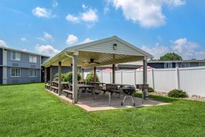a gazebo with a picnic table and a grill at Comfort Inn Lancaster County North in Denver