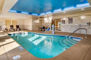 a large swimming pool in a hotel room at Comfort Suites Gulfport in Gulfport