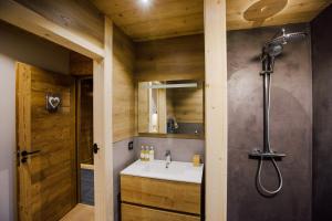 a bathroom with a sink and a shower at Chalet Melodie in Morzine