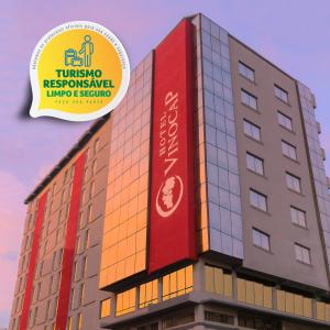 a building with a sign on top of it at Hotel Vinocap in Bento Gonçalves