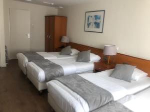 
A bed or beds in a room at Delta Hotel City Center
