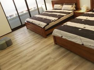 Postel nebo postele na pokoji v ubytování 瑞恒行館Reui Heng Guesthouse