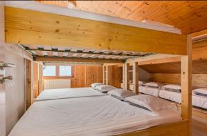 מיטה או מיטות בחדר ב-Refuge Le Marcheuson