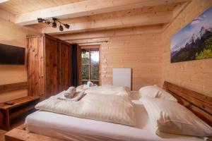 Postel nebo postele na pokoji v ubytování Chalet Risus Vallis Lachtal