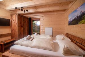 Säng eller sängar i ett rum på Chalet Risus Vallis Lachtal
