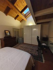a bedroom with a bed and a desk and a window at Sweet Home in Imola
