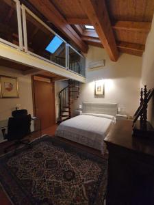 a bedroom with a bed and a large rug at Sweet Home in Imola