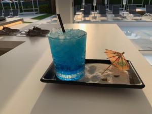 a drink on a tray on a table at Sanom Beach Resort Only Adults in Playa del Ingles