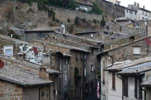 a group of buildings on the side of a mountain at Alla cava Orvieto in Orvieto
