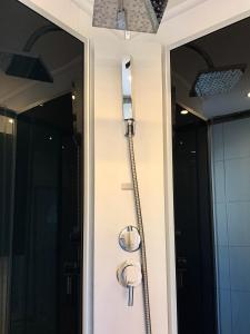 a door with a water hose hooked up to it at Chez Nous en fait in Salzburg +15 photos