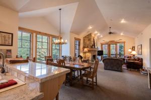 a kitchen and living room with a table and chairs at Town Point Condos by Park City Vacations in Park City