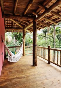 Uma varanda ou terraço em Pousada Tubes Maresias