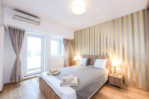 En eller flere senge i et værelse på New luxury flat at Unirii Square, Piata Unirii
