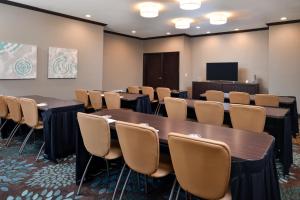 a conference room with tables and chairs and a screen at Staybridge Suites Wichita Falls by IHG in Wichita Falls +40 photos