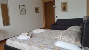 Postel nebo postele na pokoji v ubytování B&B in Arena L' Opera