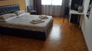 Postel nebo postele na pokoji v ubytování B&B in Arena L' Opera