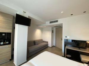 Łóżko lub łóżka w pokoju w obiekcie Gkeea Boutique Hotel