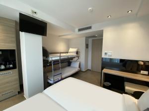 Łóżko lub łóżka w pokoju w obiekcie Gkeea Boutique Hotel