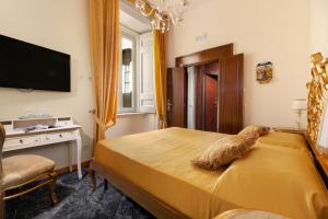 Giường trong phòng chung tại Relais Antica Napoli