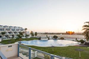 a view of a swimming pool in a resort at Livingtarifa Apartamento Entre Dos Aguas in Tarifa