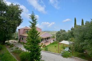an aerial view of a house with a tree at Villa Kardami -country house in Agios Gordios