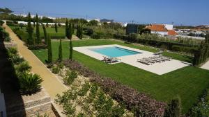 an overhead view of a garden with a swimming pool at Apartamento 7 Mares com 2 Quartos in Sagres