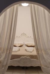 A bed or beds in a room at Dimora del ciliegino