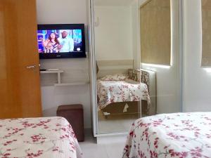 Cama o camas de una habitación en Prive das Thermas II (RPT 2)
