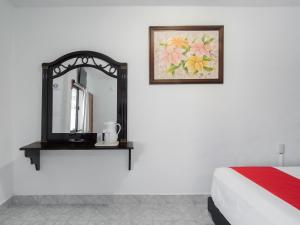 Postel nebo postele na pokoji v ubytování Hotel Casa Poblana