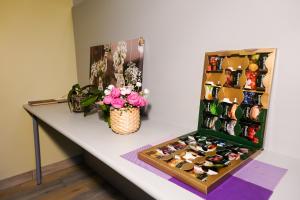 a table with a display of shoes and flowers at Шале Тюленя - Шереметьево in Moscow