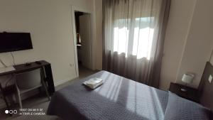 A bed or beds in a room at B&B Grandangolo