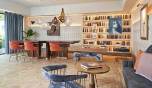 a living room with a table and chairs at Viceroy Washington DC in Washington, D.C.