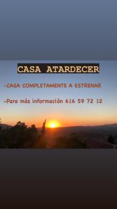 a sunset with the words casa antelopezos computererate a transmitter at Casa Atardecer in Zahara de la Sierra