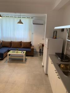 a living room with a couch and a table at EXCLUSIVE COMFORT PREMIUM in Beer Sheva