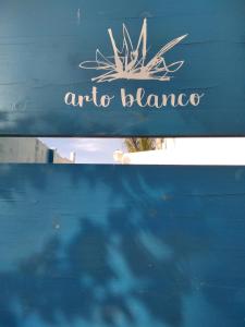 a sign for anaru blanca on a blue bench at Arto Blanco in Agua Amarga