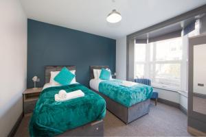 Postelja oz. postelje v sobi nastanitve Central location for contractors, families and business travellers Ashford