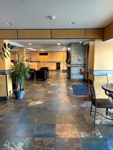 an empty lobby with a table and chairs in it at GetAways at Park Regency Resort in Park City