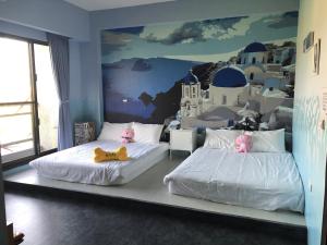 Postel nebo postele na pokoji v ubytování Ching Yu Rou B&B