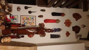 a wall with a bunch of wooden objects on it at Guest House Kapetanova Kuća in Križevci