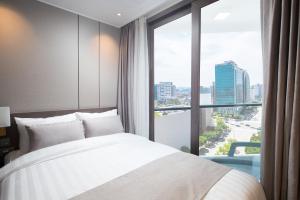 Ein Bett oder Betten in einem Zimmer der Unterkunft Utop Boutique Hotel&Residence