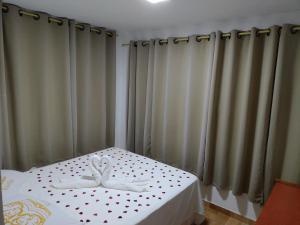 Postel nebo postele na pokoji v ubytování Pousada das Orquideas