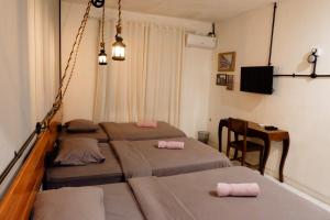 Кровать или кровати в номере Buton Backpacker Lodge