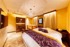 Postel nebo postele na pokoji v ubytování HOTEL Artia Izumiotsu (Adult Only)