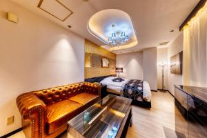 Postel nebo postele na pokoji v ubytování HOTEL Artia Izumiotsu (Adult Only)