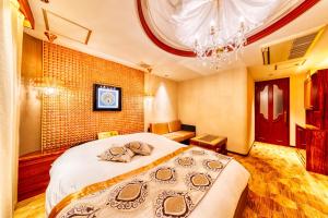 Postel nebo postele na pokoji v ubytování HOTEL Artia Izumiotsu (Adult Only)