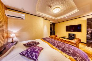 Postel nebo postele na pokoji v ubytování HOTEL Artia Izumiotsu (Adult Only)
